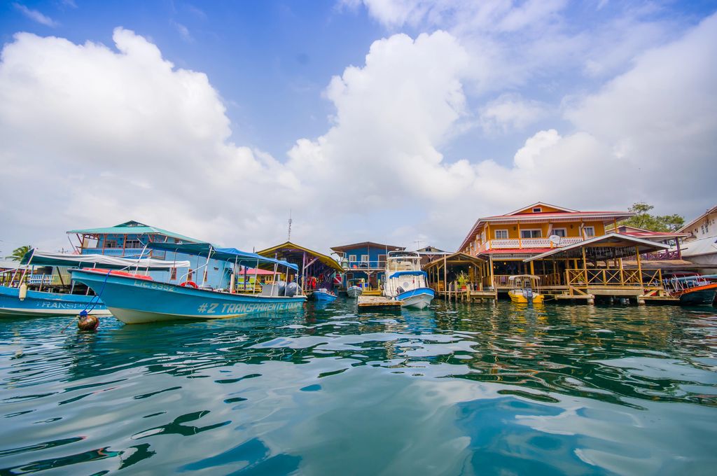 Floating houses and boats on the water in Bocas del Toro, Panama.