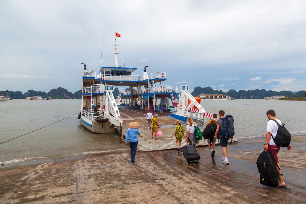 People riding a ferry in Vietnam.