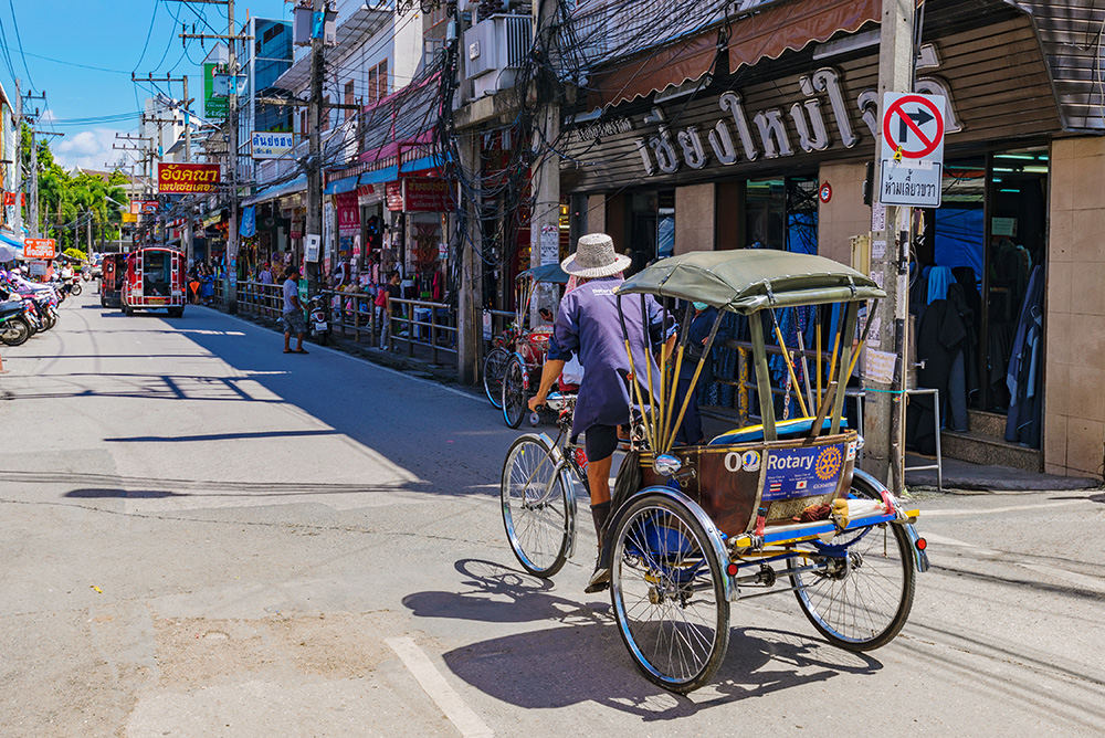 Stores on the side of a road in Chiang Mai, Thailand.