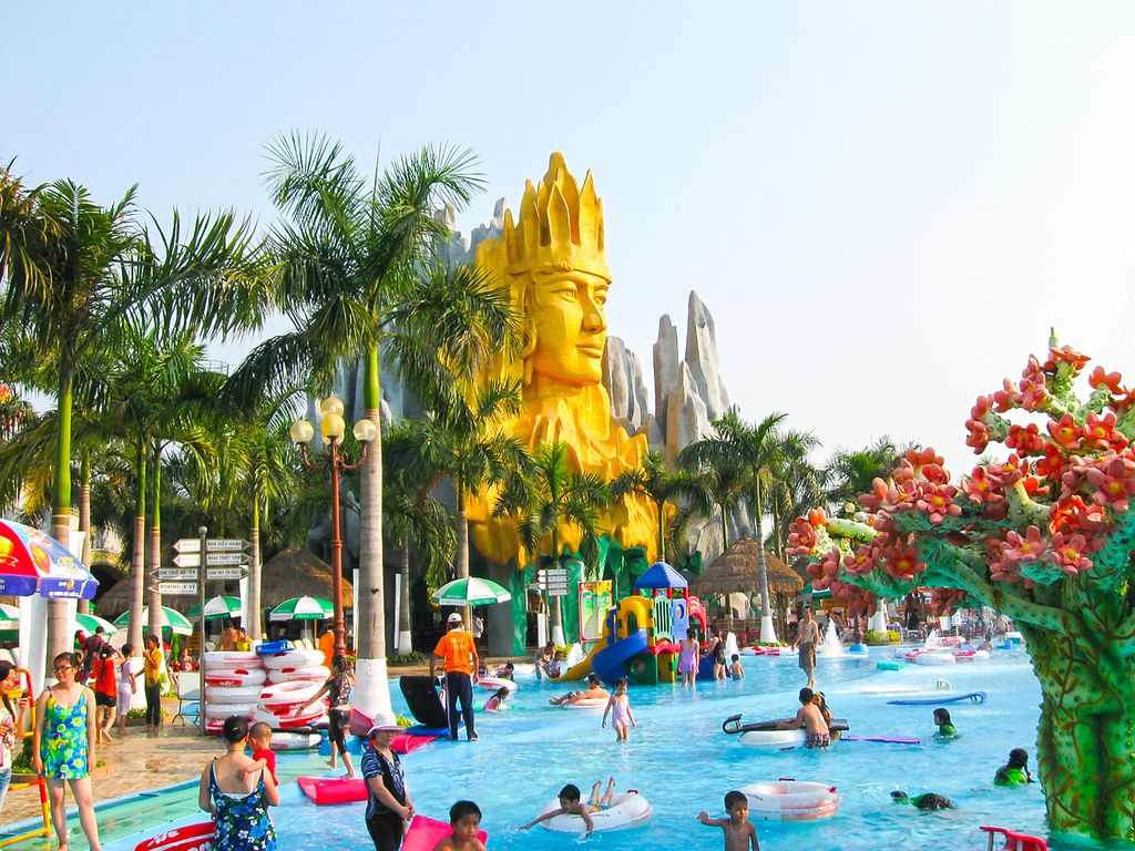People at a waterpark in Ho Chi Minh City with a giant sculpture.
