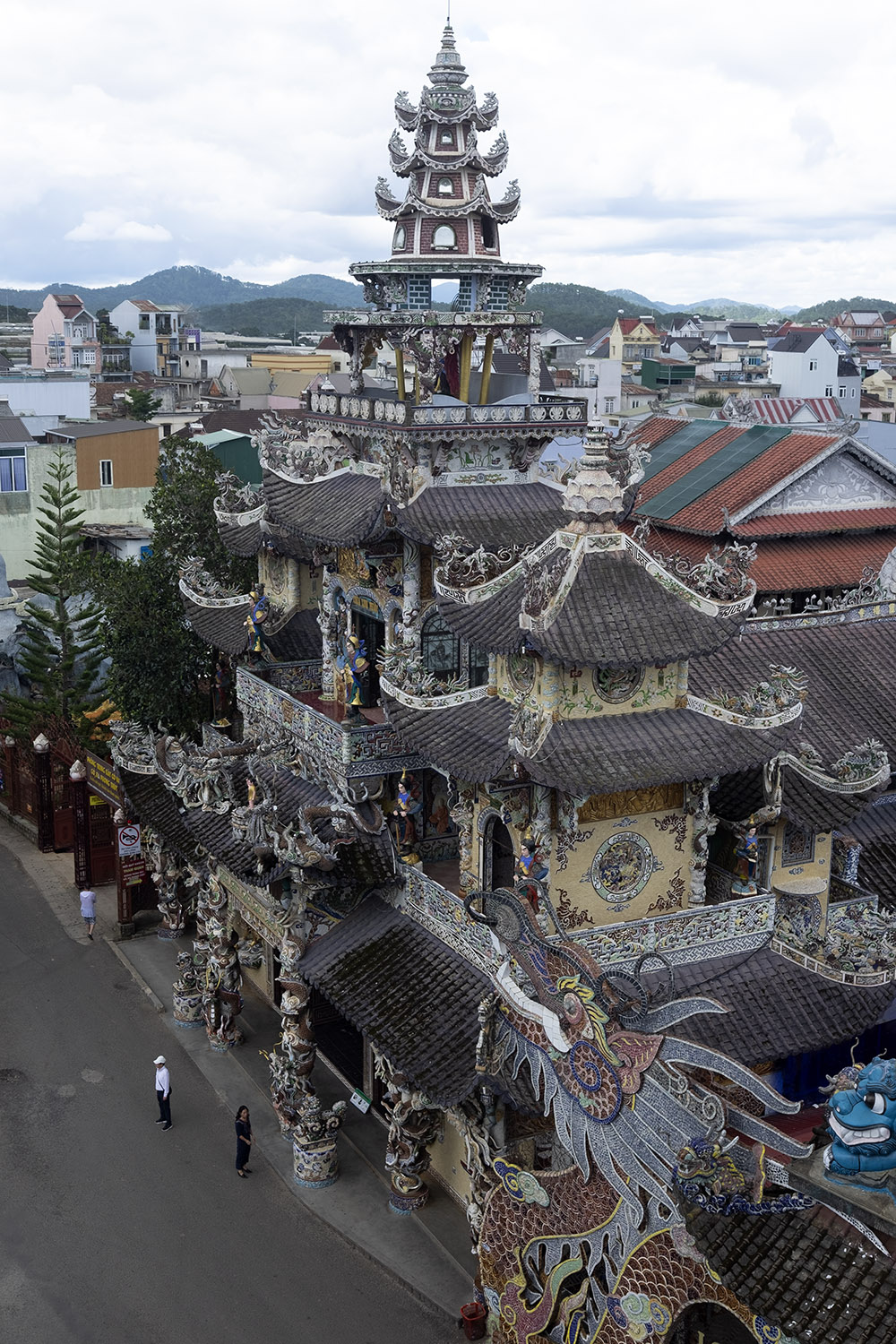 A building with complex carvings of giant and other creatures onto the roof in Dalat, Vietnam.