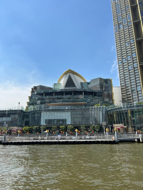 The front of a mall and river in Bangkok, Thailand.
