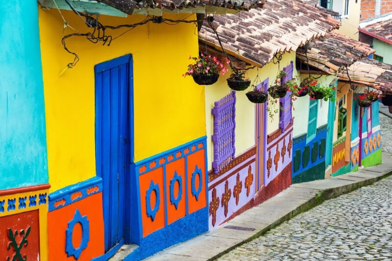 Colorful building walls on a street in La Candelaria, Bogota, Colombia.