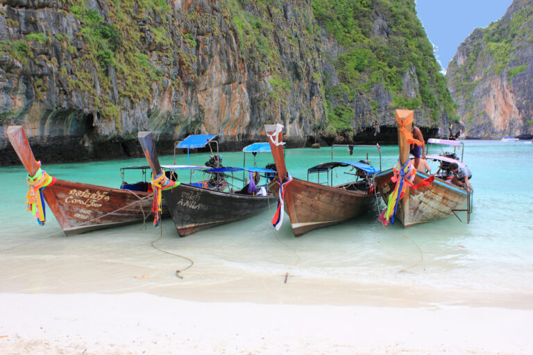 Longtail boats on tropical beach