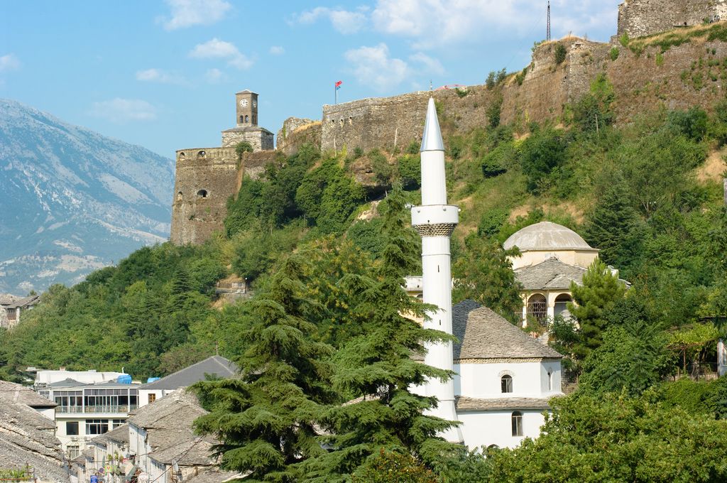 The outside of a mosque and a clock tower in Gjirokaster, Albania.