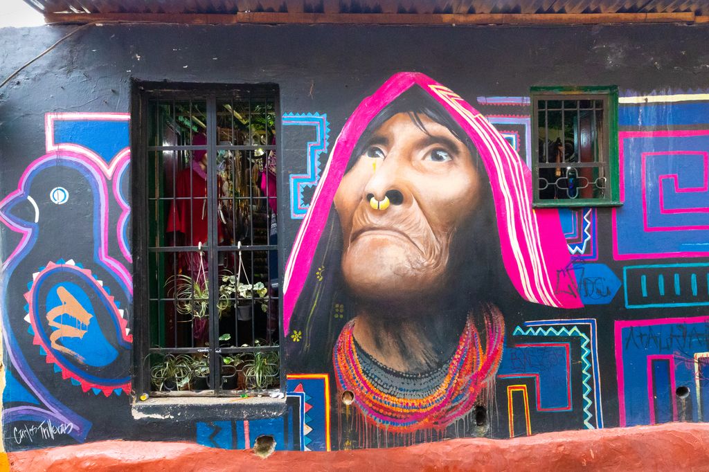 A mural of a face of an old man.