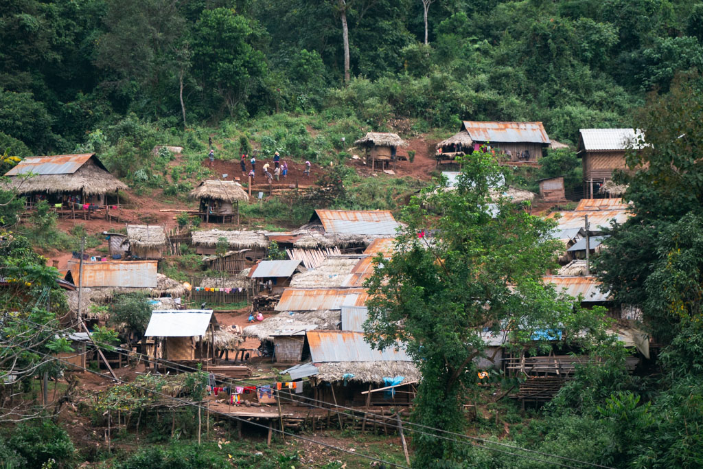 A rural town surrounded by trees in Luang Namtha, Laos.