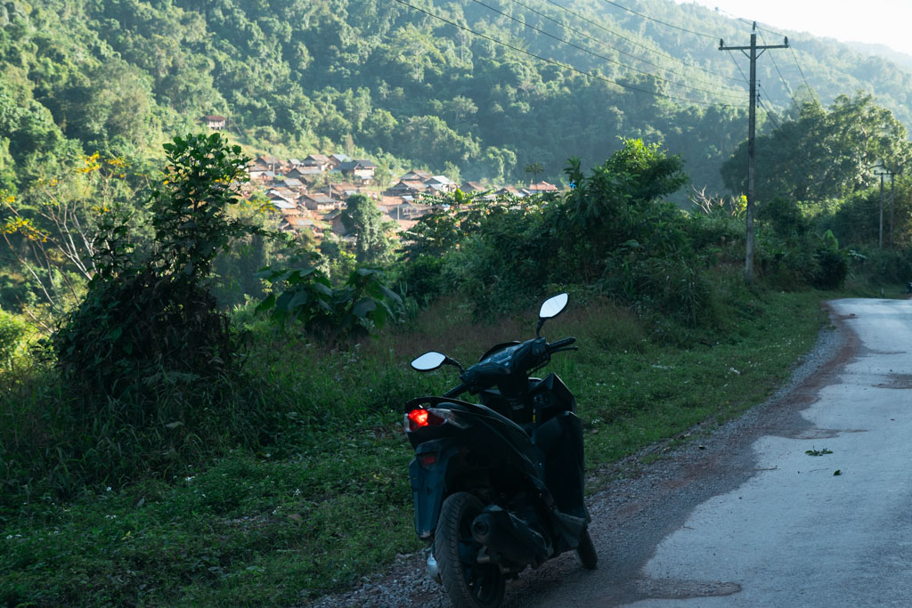 A motorcycle parked on a road in Luang Namtha, Laos.