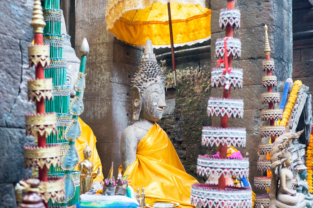 A statue surrounded by colorful decorations.