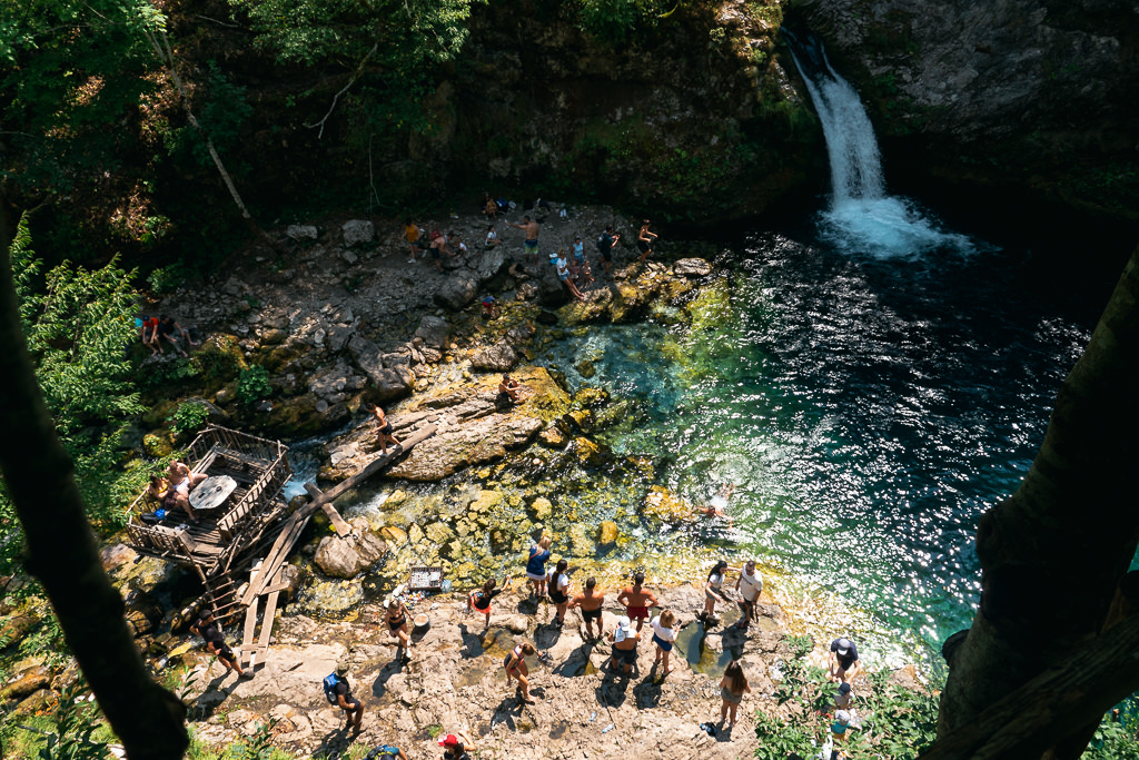 People swimming at a waterfall in Albania