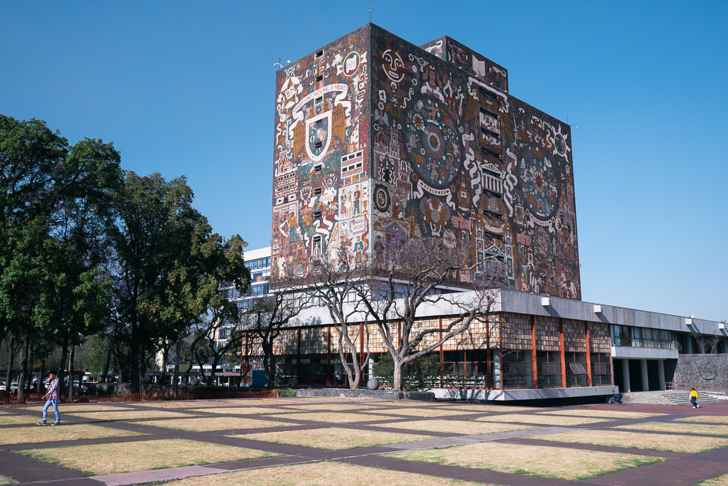 The facade of the National Autonomous University of Mexico with art.