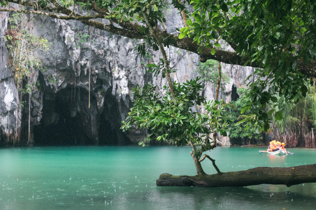 The entrance to the Puerto Princesa Underground River, framed by lush green foliage