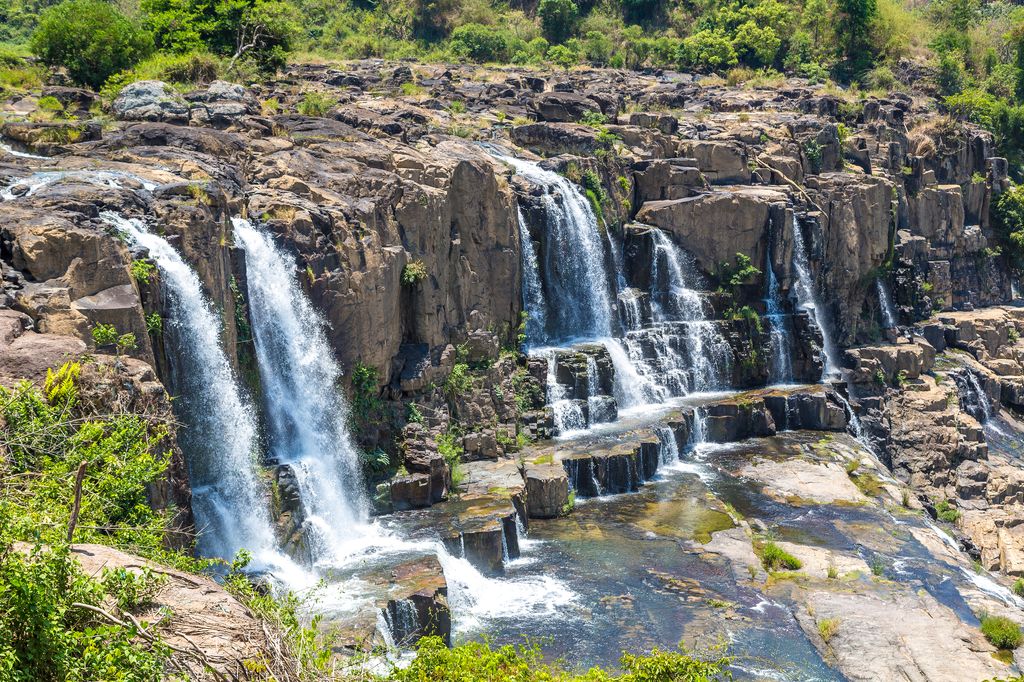 Waterfalls on a rocky cliff in Dalat, Vietnam.