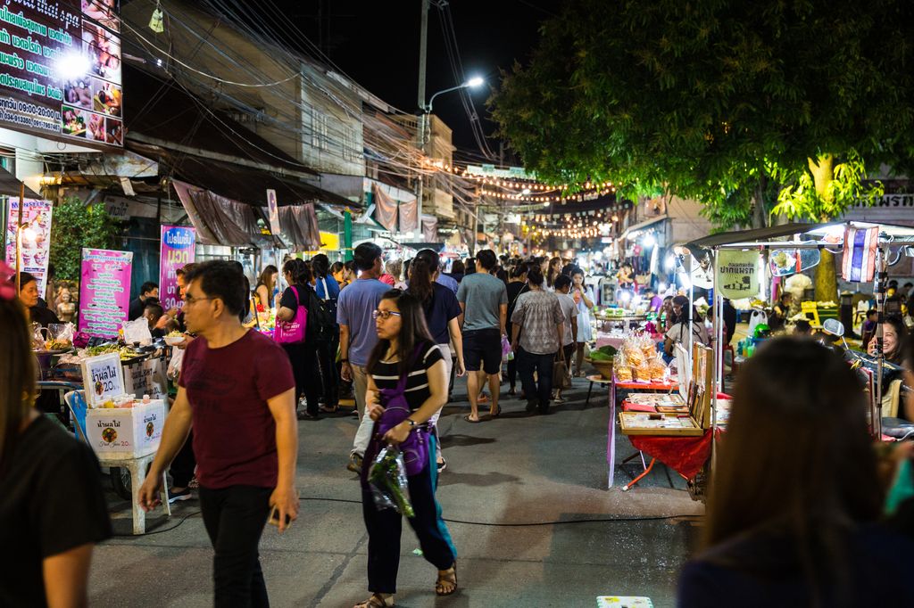 People on the street at the Saturday night marekt in Kanchanaburi, Thailand.
