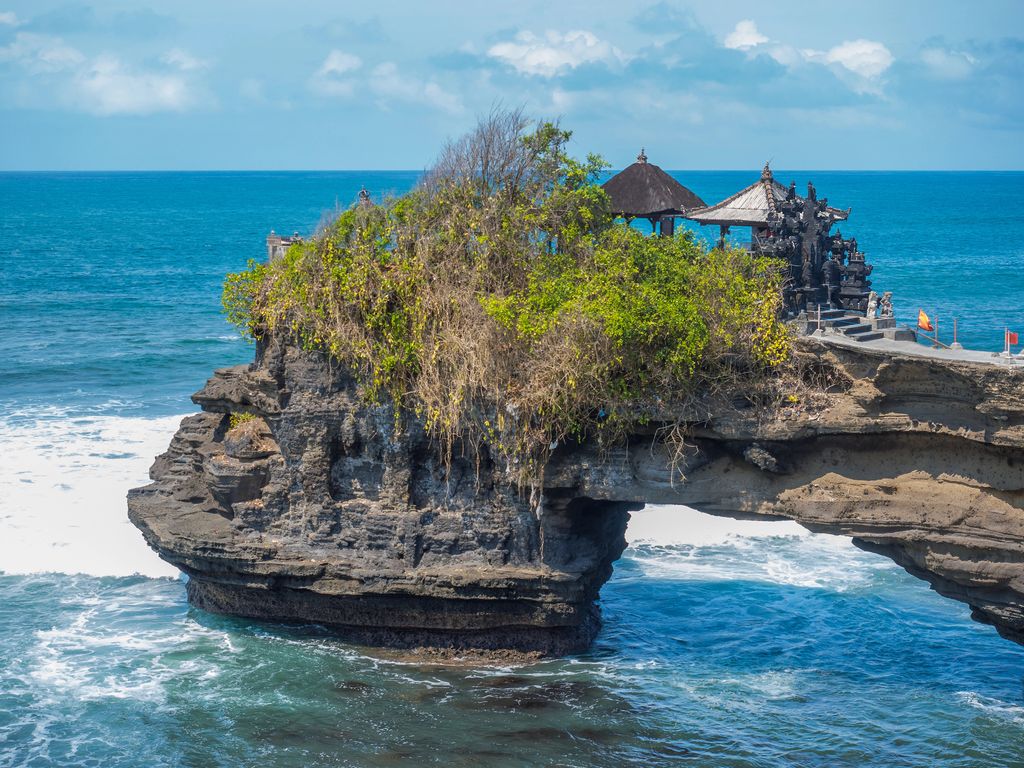 Tanah Lot rock formation at the sea in Bali, Indonesia.