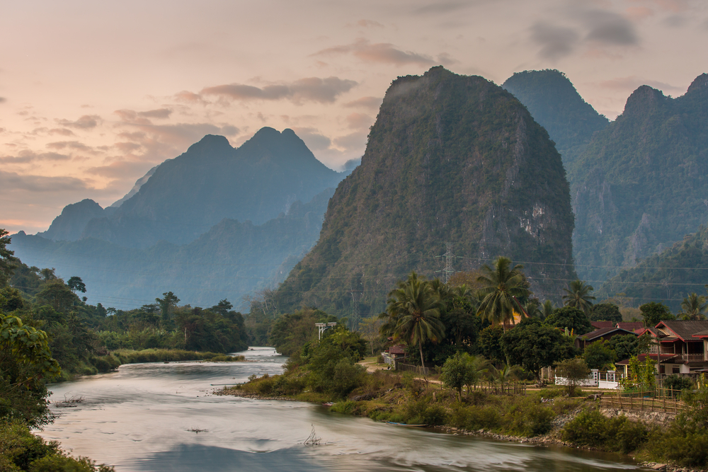 A town with river, mountains, and houses in Vang Vieng, Laos.