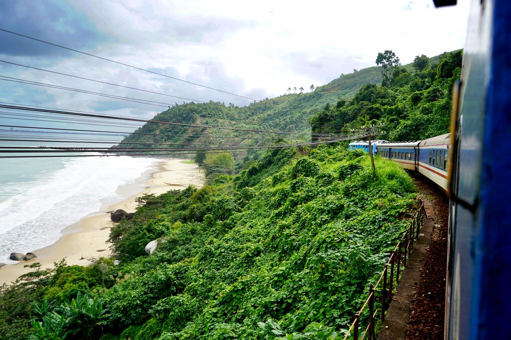 Train in Vietnam passing by the mountains and the sea.
