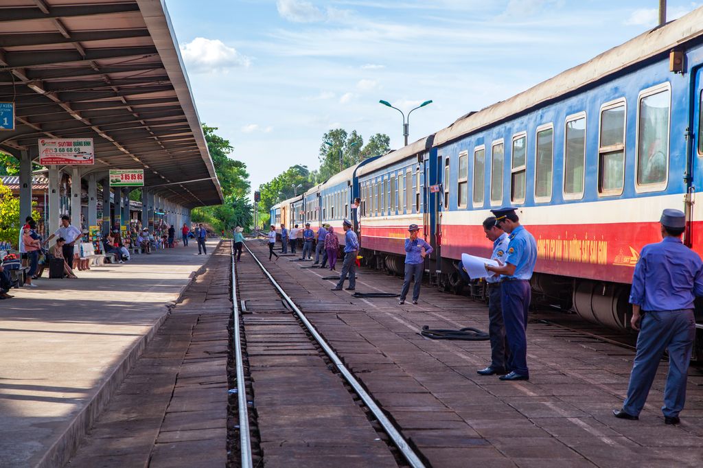Guards standing by a railway station in Vietnam.